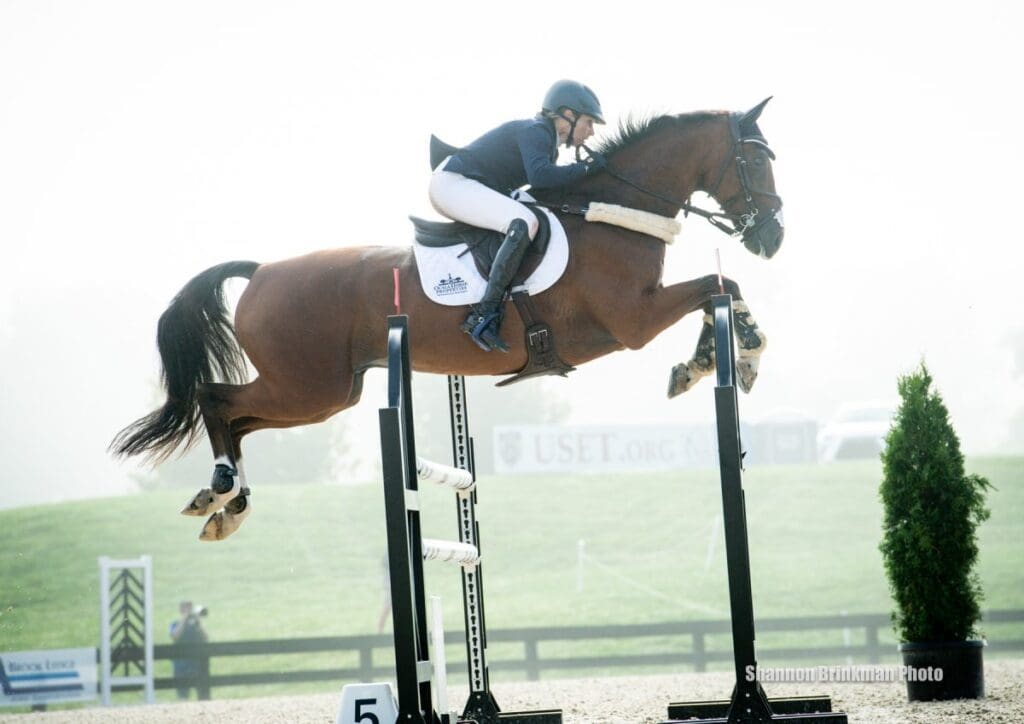 Liz Halliday Sharp and Deniro Z on their way to a clear showjumping round at Great Meadow International. PC: Shannon Brinkman