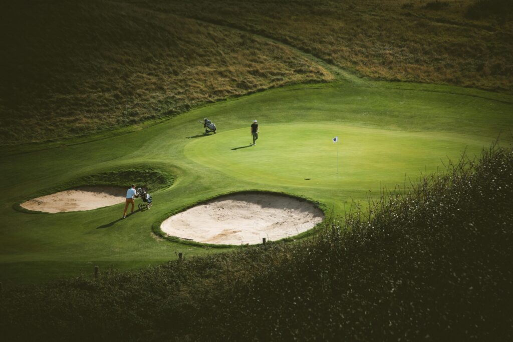 Golf course greens with sand bunkers.