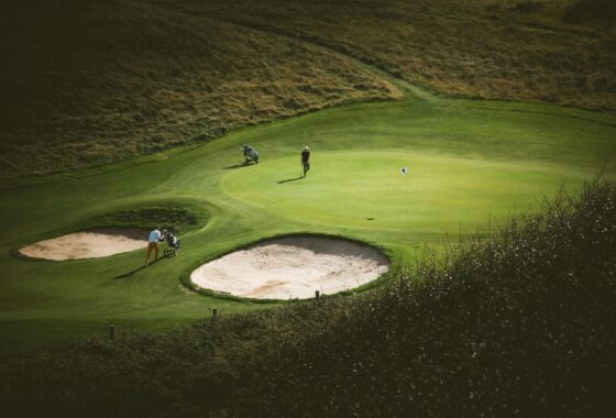 Golf course greens with sand bunkers.