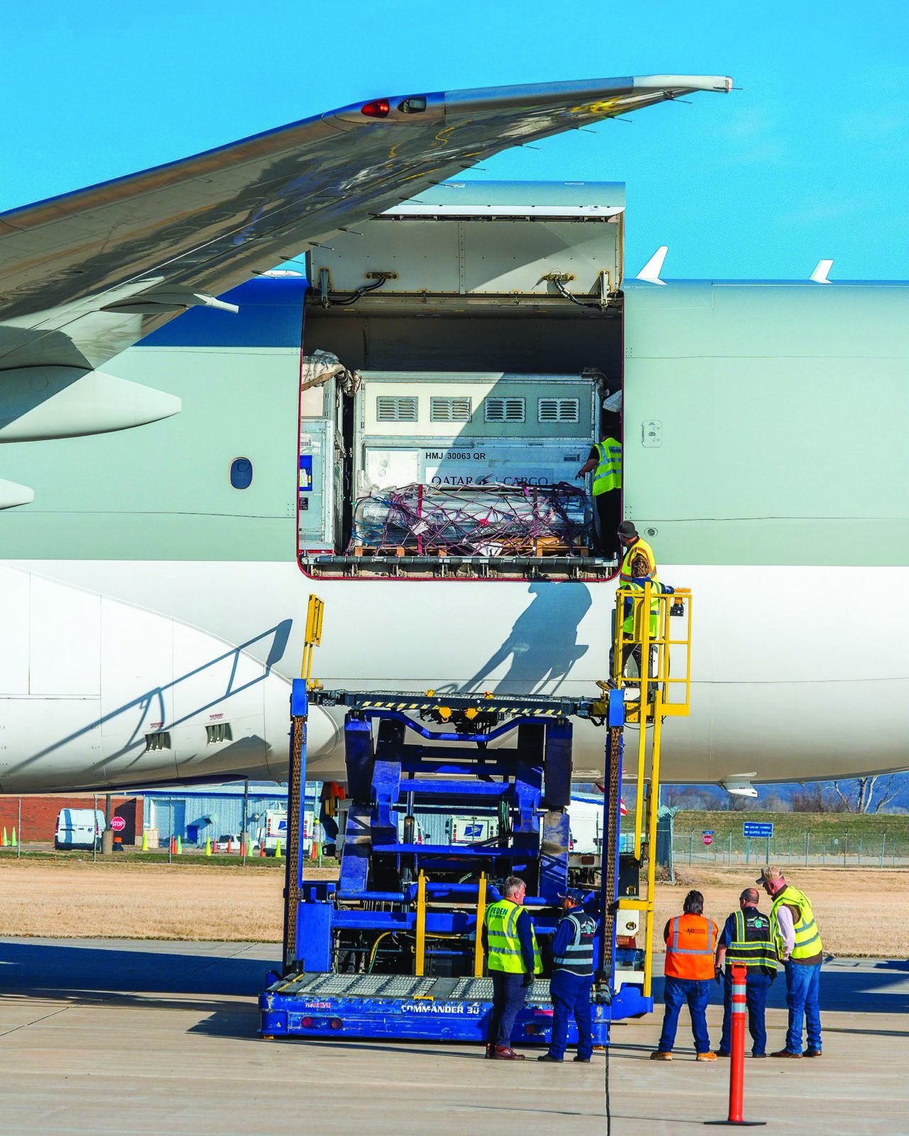 Horse transport container being loaded into a cargo aircraft